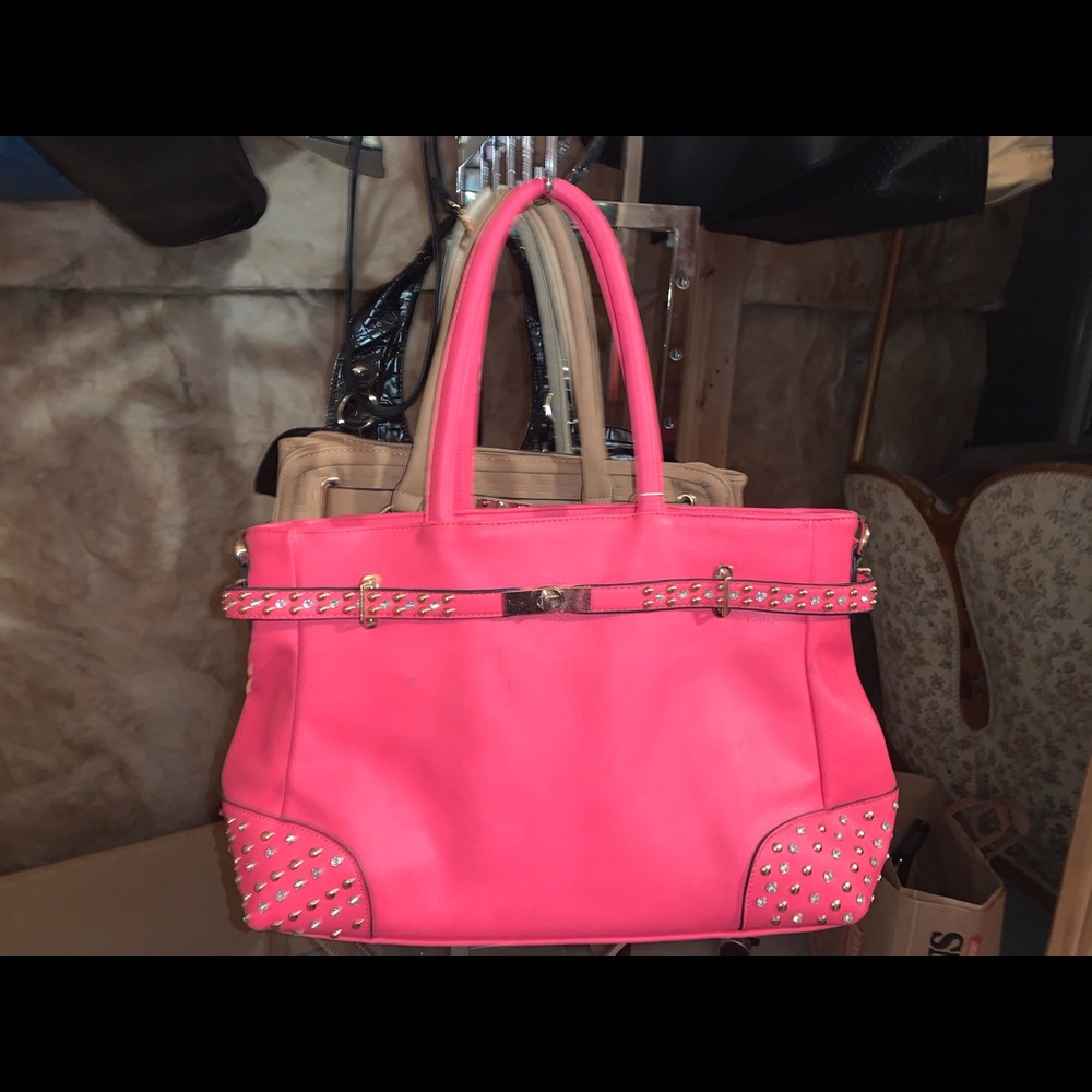 Darling pink purse with metal embellishments on the front & silk lined interior